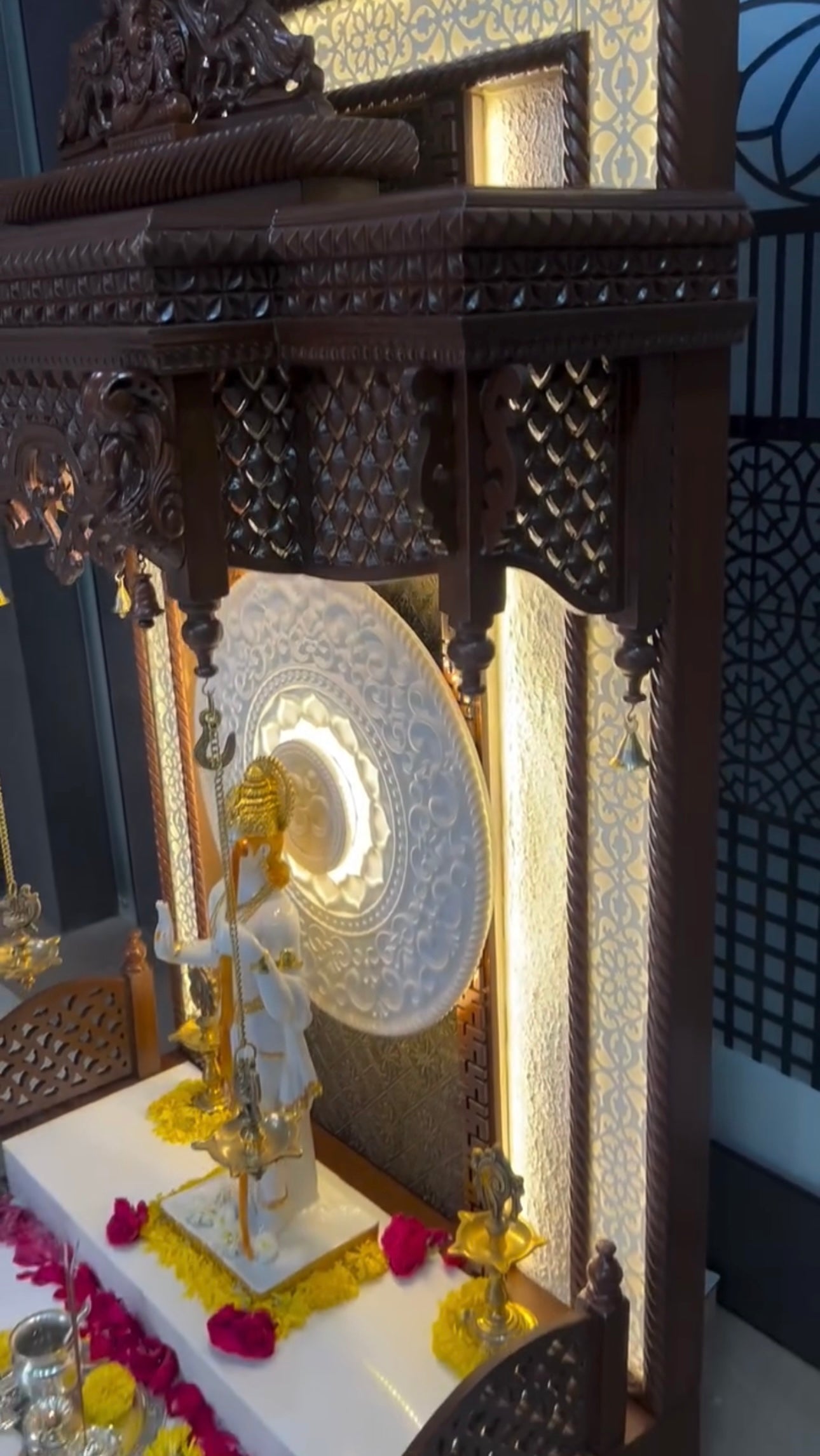 Rich teak wood pooja mandir with LED illumination, perfect for elegant and devotional home interiors.