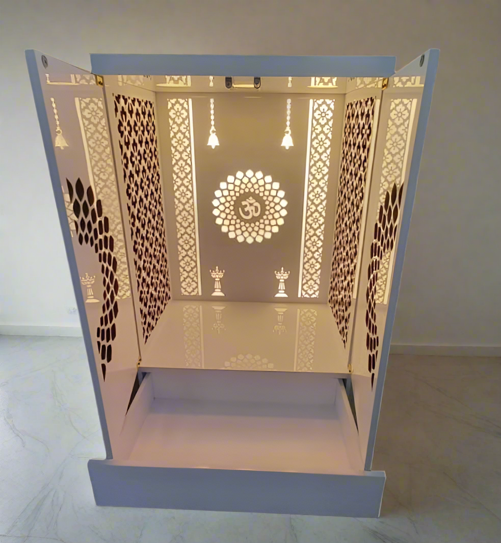 A premium white wooden pooja mandir with detailed laser-cut patterns and warm LED lighting inside, creating a serene spiritual environment for daily prayers.