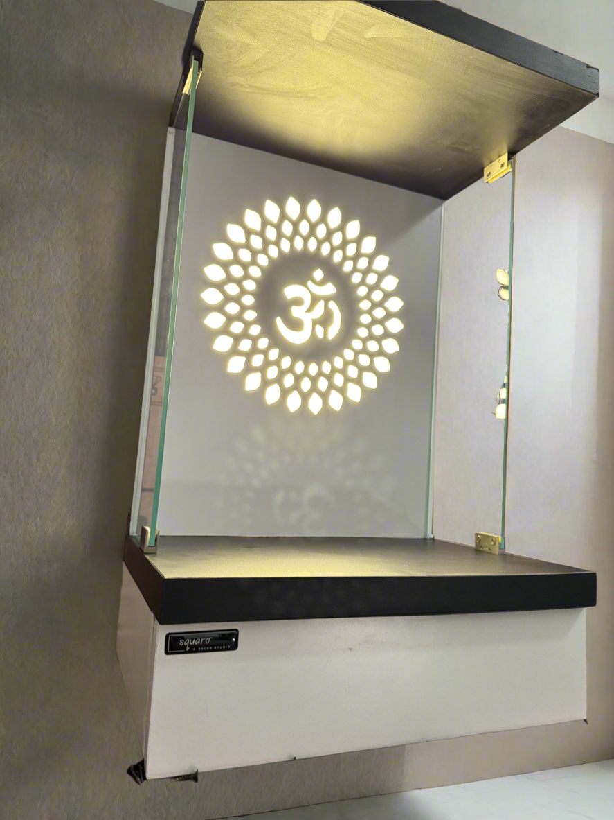 A space-saving wooden temple with glass sides and an illuminated Om motif for a serene ambiance.