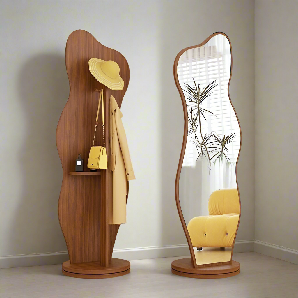 Sculptural standing mirror with abstract frame and multifunctional coat hanger, combining functionality and art for hallway or dressing room.