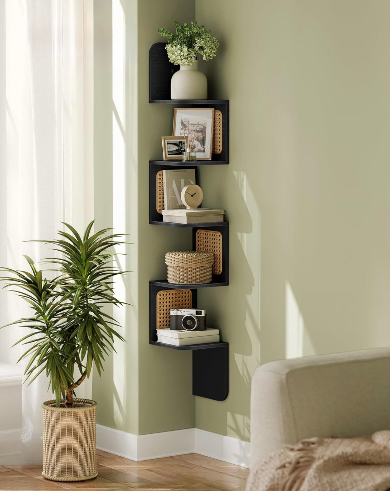 Five-tier wooden corner shelf with cane accents, wall-mounted and styled with plants and décor.