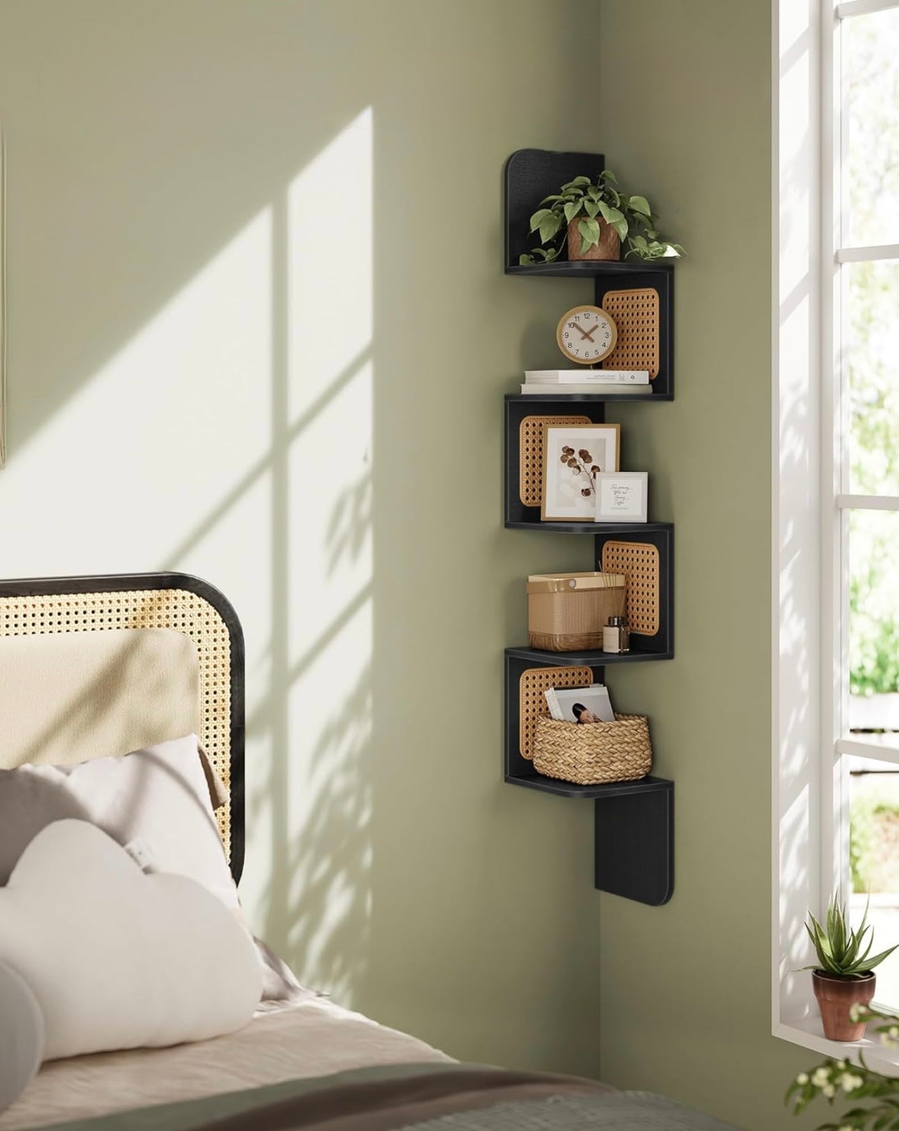 Natural wood corner shelf with cane panels, mounted in a cozy reading nook with warm lighting.