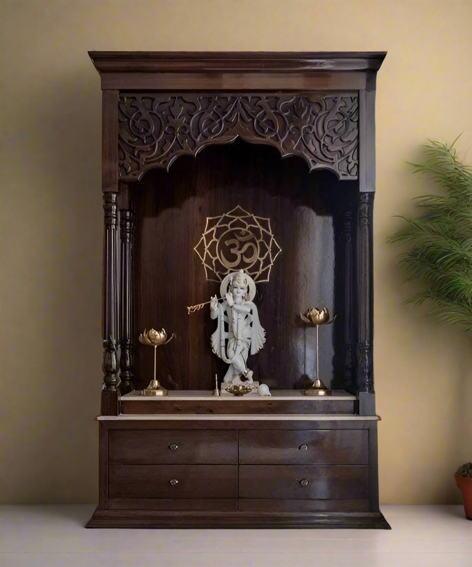 Handcrafted dark wooden pooja mandir with Lord Krishna idol, intricate carvings, and brass lotus lamps, ideal for modern Indian homes.
