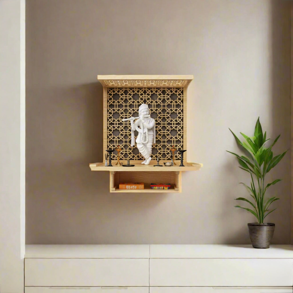 Compact wooden pooja mandir with intricately carved jaali panel and white Krishna idol, perfect for small Indian home temples and wall-mounted setups.