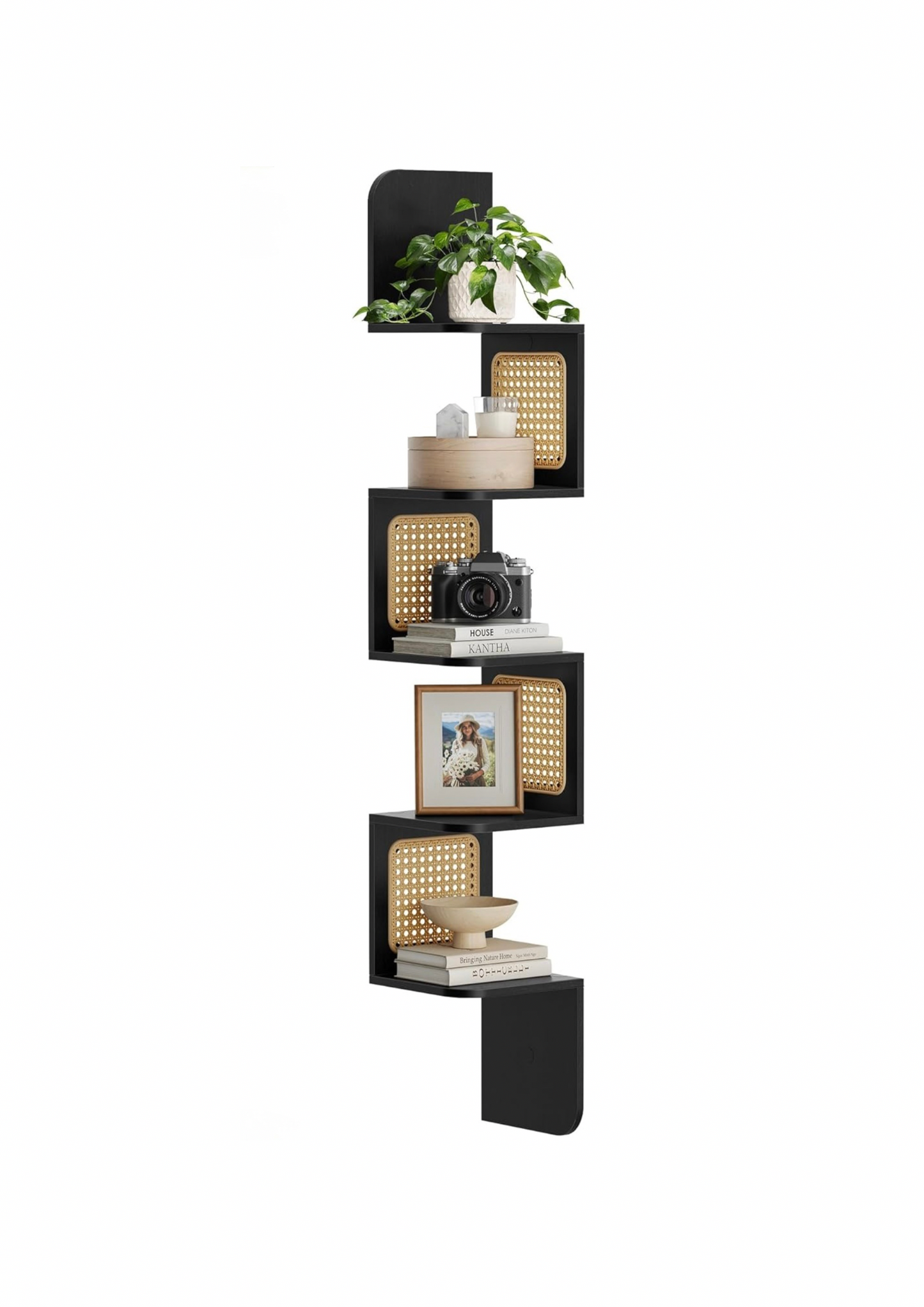 Floating black corner shelf with five cane-lined levels, styled in a minimalist interior.