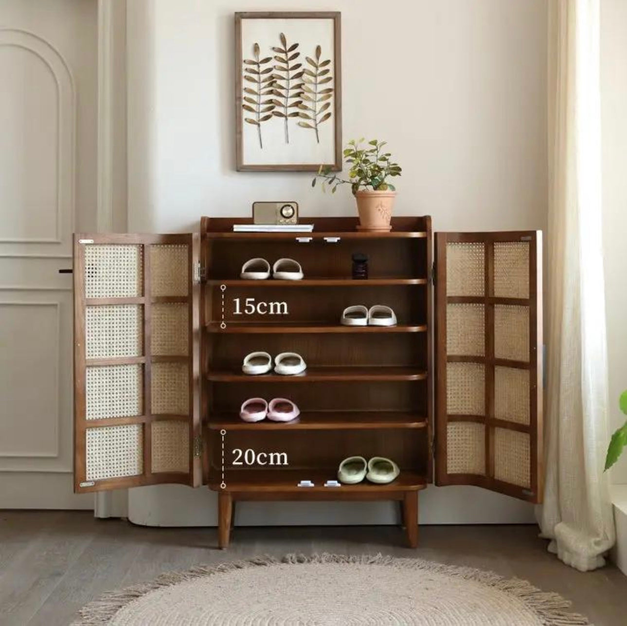 Open solid wood shoe rack cabinet with natural cane doors and adjustable shelves spaced at 15cm and 20cm, holding various pairs of shoes.