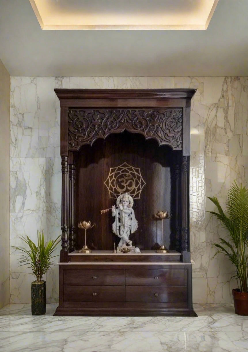 Elegant wooden home temple with marble floor base, Krishna idol, Om symbol backdrop, and brass accessories in a contemporary setting.