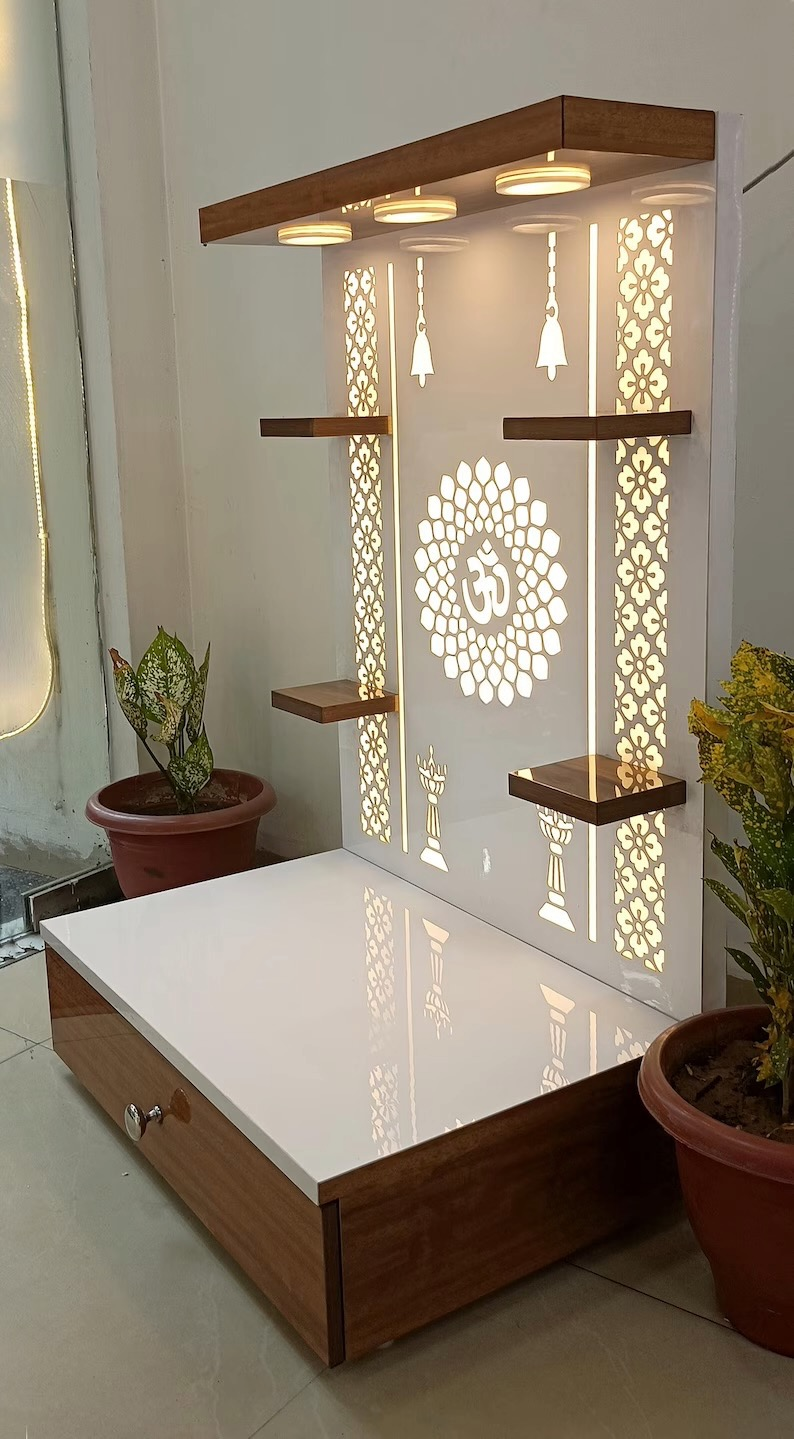 Side view of wall-mounted Pooja mandir with decorative wooden shelves and illuminated floral laser cut panel design, ideal for home temple decor.