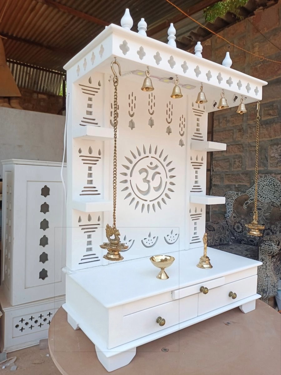 Handcrafted white wooden mandir with traditional diya motifs and brass accents