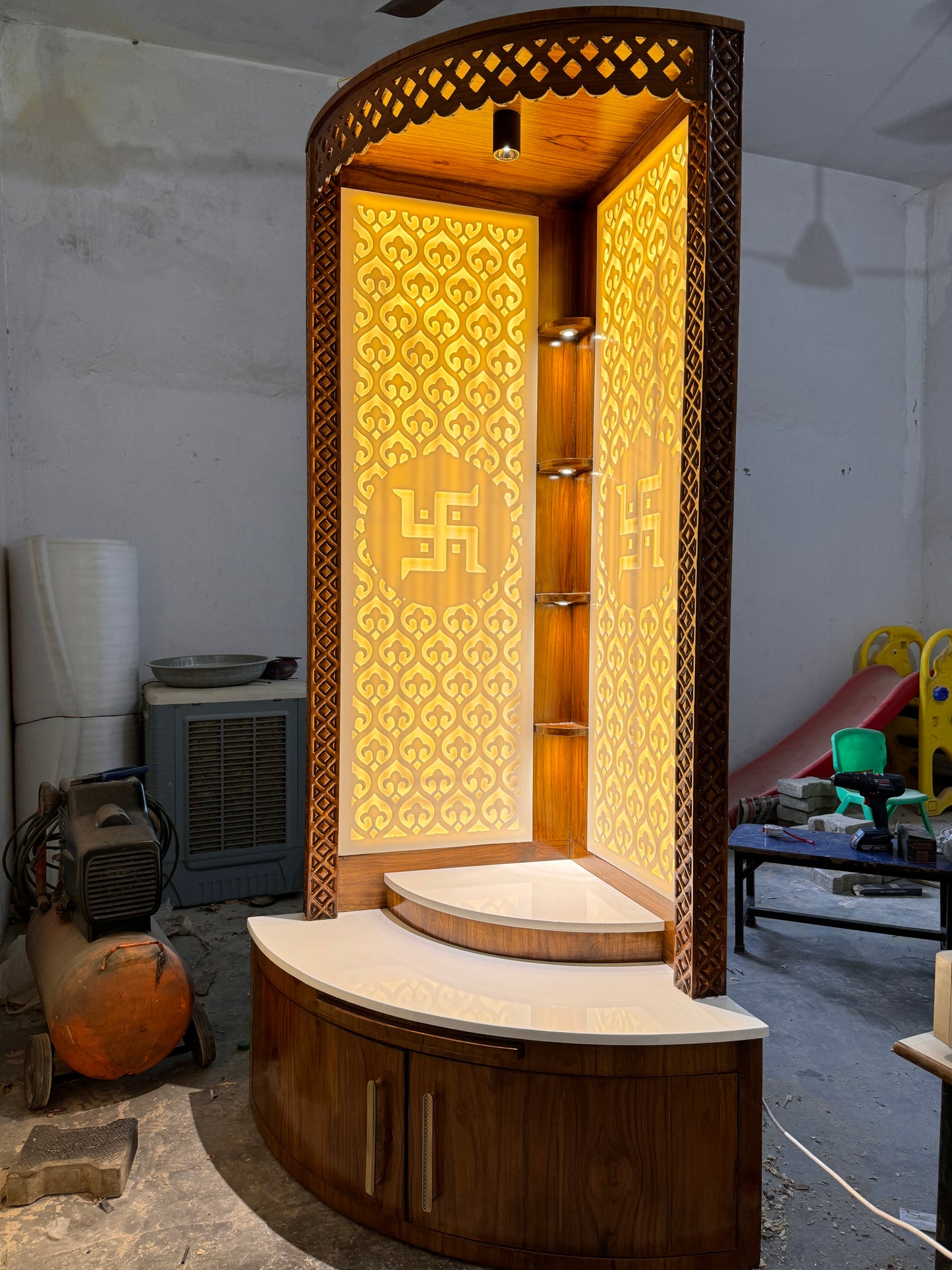 Designer home temple with 3D Swastik engraving and glowing LED backlight in corner setup
