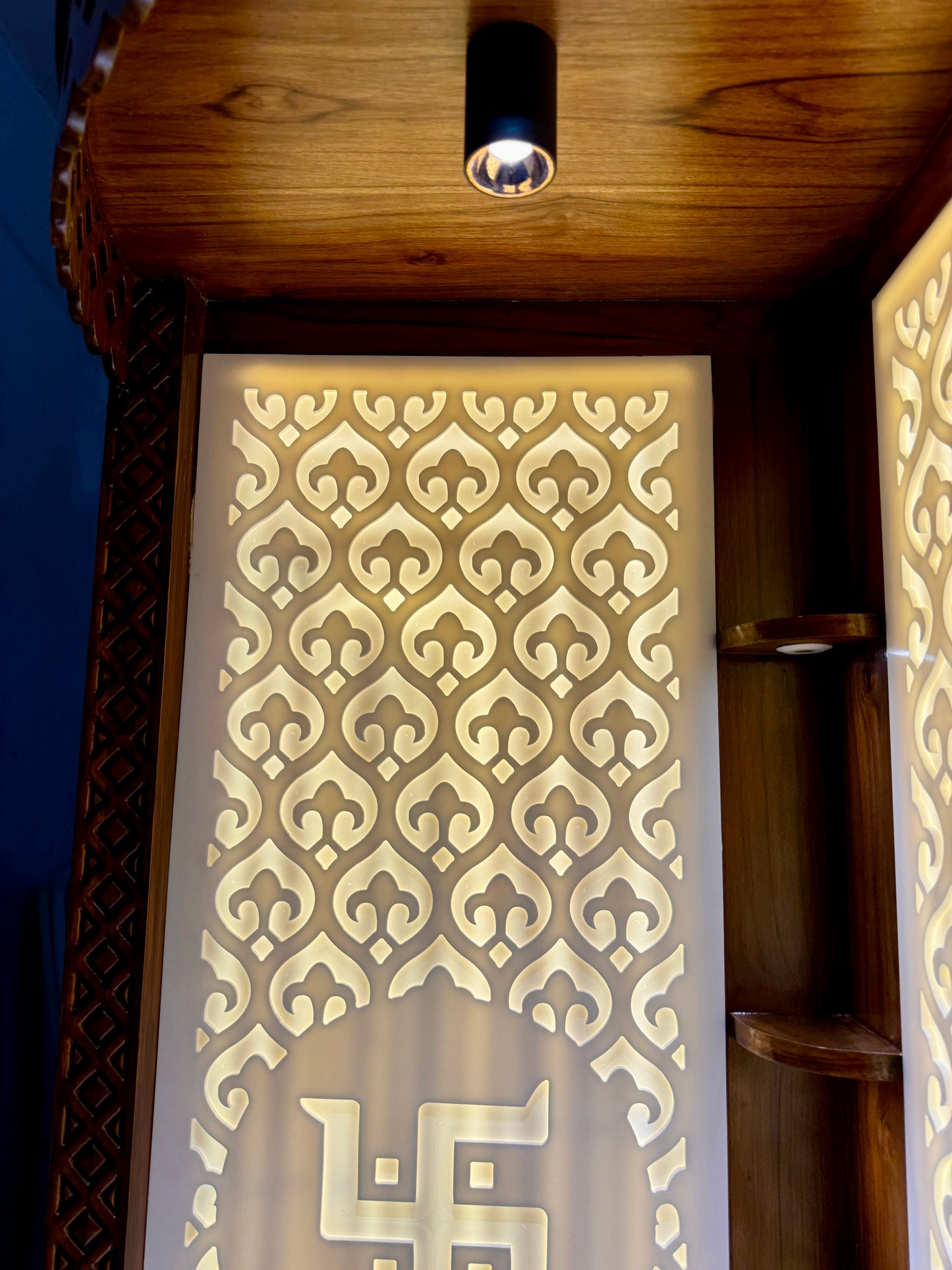 Stylish wooden pooja mandir with built-in lighting and detailed laser cut design