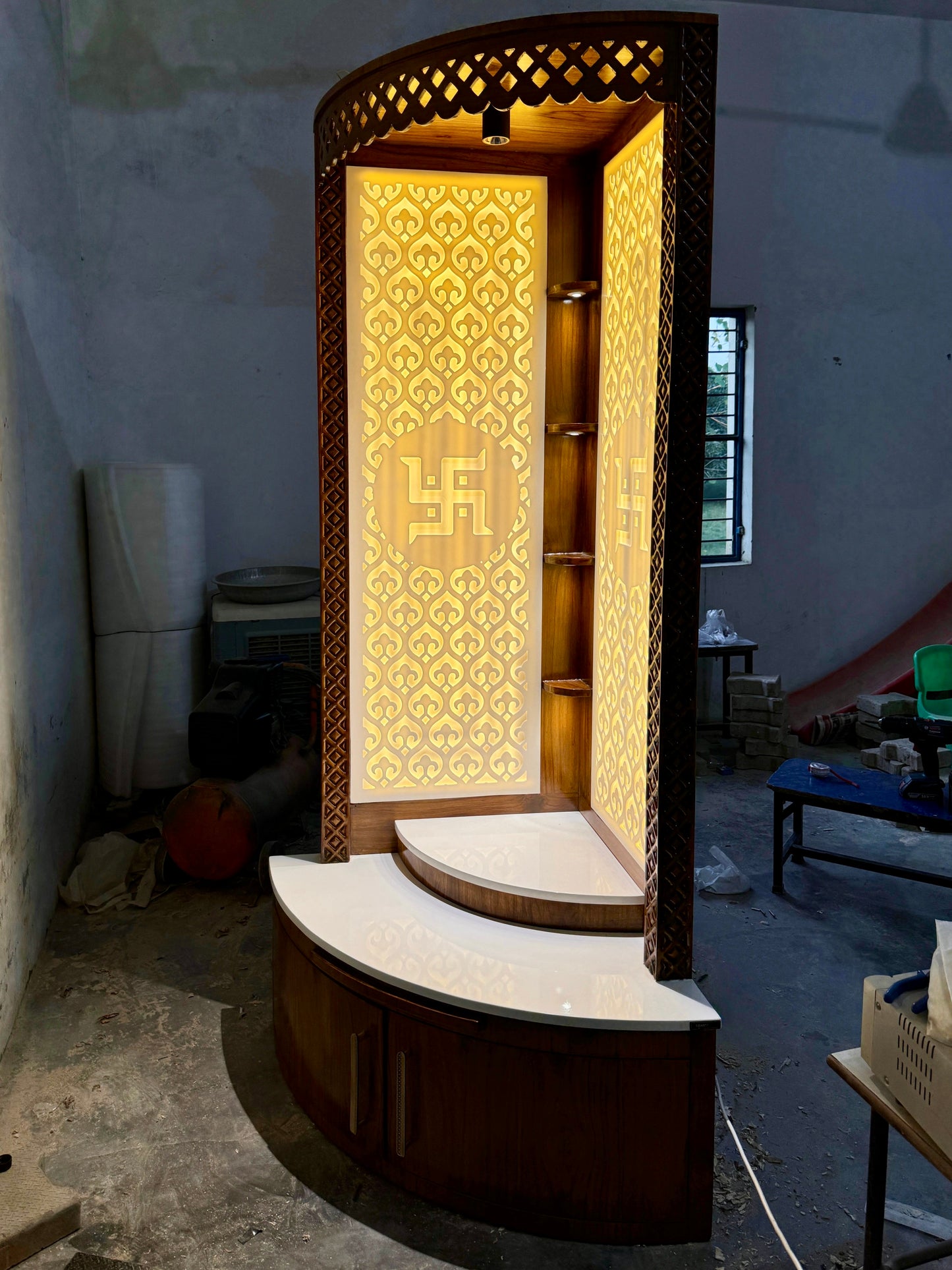 Contemporary wall corner mandir with carved Swastik and teak finish