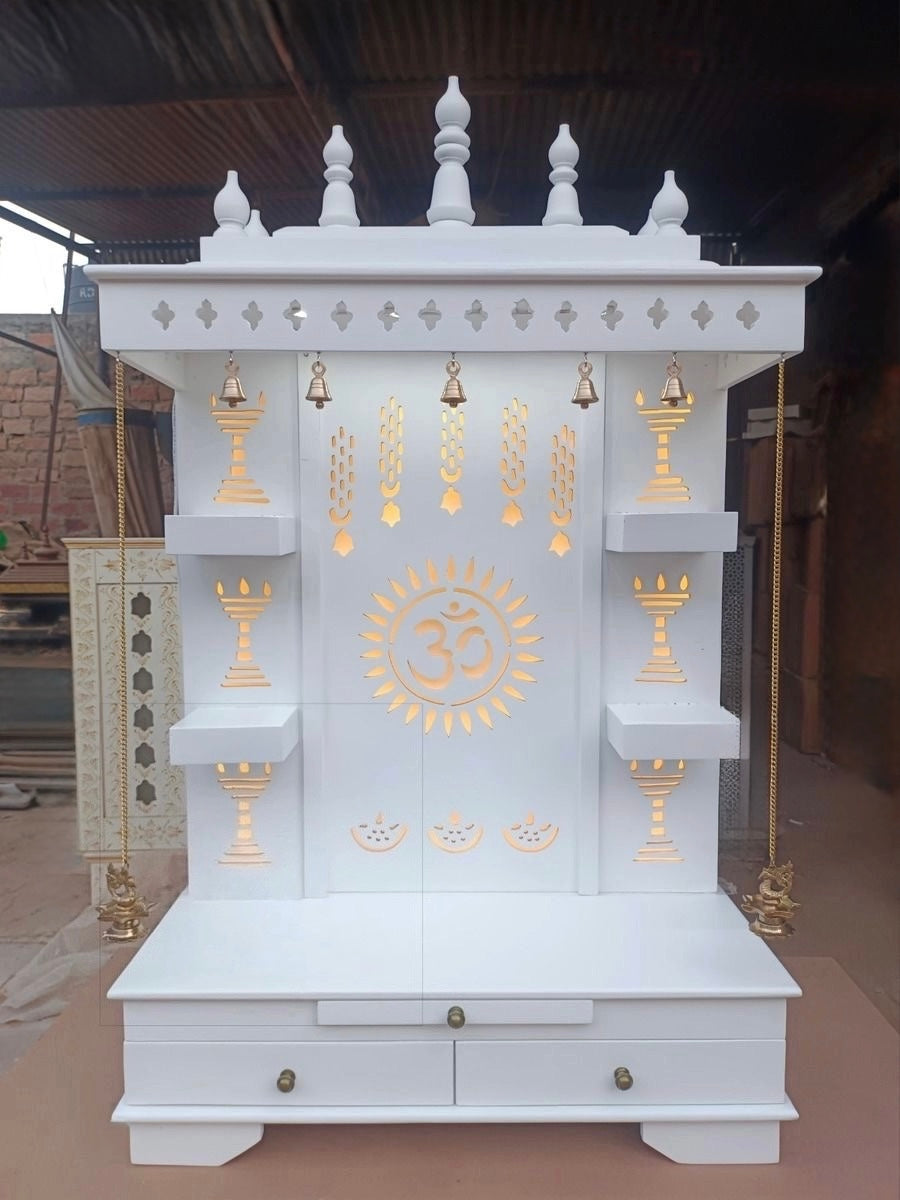 Traditional white wooden home temple with brass bells, LED lights, and carved designs