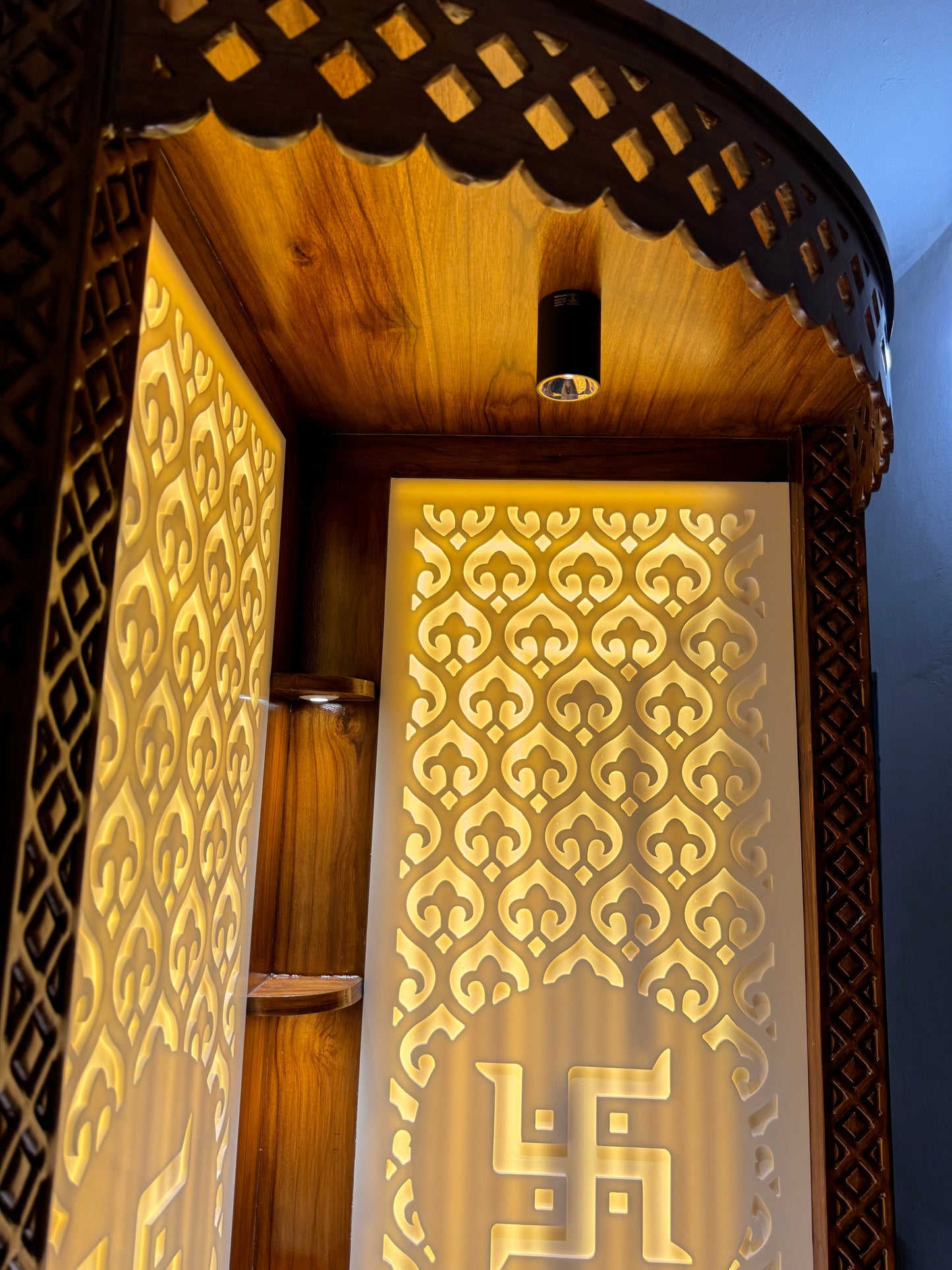 Luxury handcrafted mandir in teakwood and Corian with elegant corner mount design