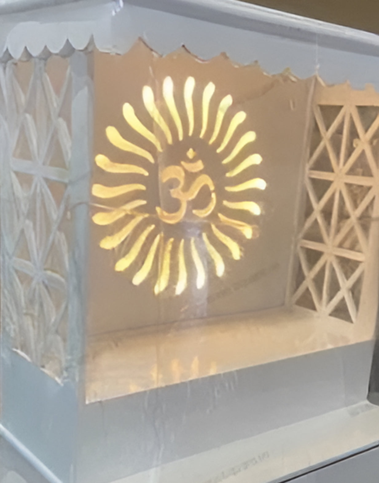 Featuring high-quality woodwork, intricate cutouts, and a drawer for storage, this pooja mandir is designed for daily rituals and devotional practices.