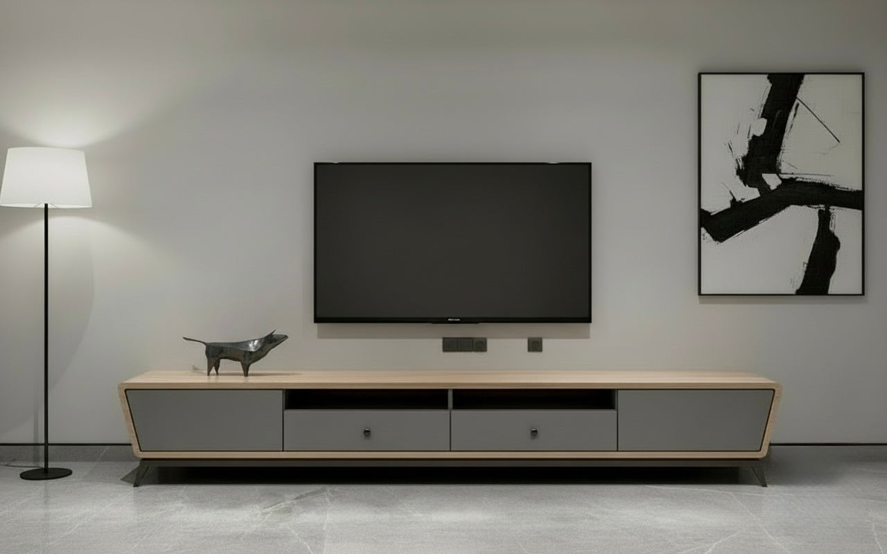 Minimalist entertainment unit with closed drawers and open shelf storage.