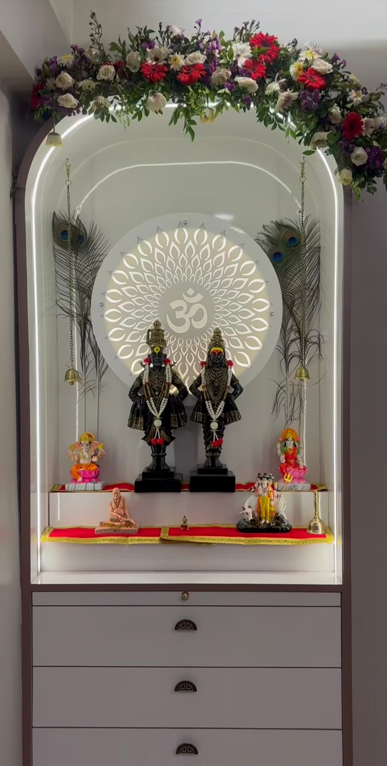 Luxury Hindu mandir with curved design, divine idols, and soft ambient lighting, ideal for peaceful home prayer space.