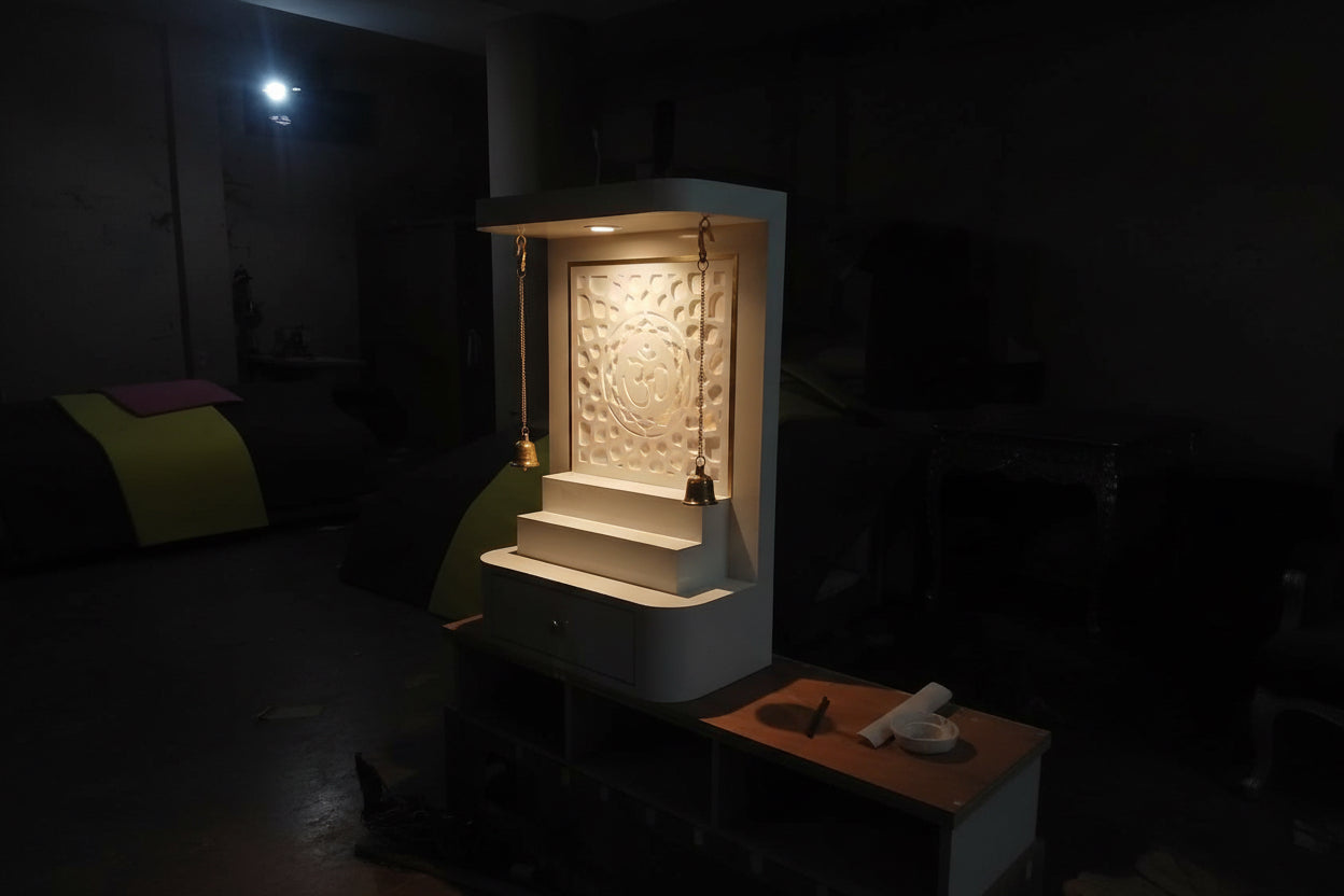 Modern LED pooja mandir with carved OM back panel and brass bells for daily worship
