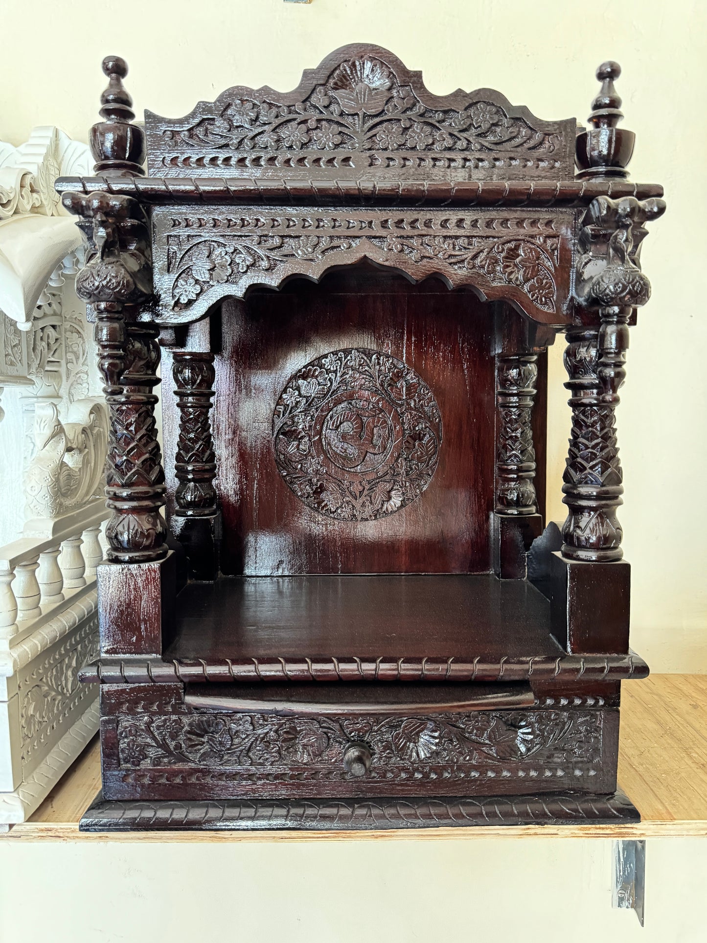 Luxurious Wooden Pooja Temple with Detailed Ornamental Carvings – Polished Dark Finish, Perfect for Home Prayer Spaces.