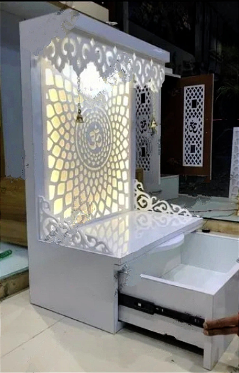 Compact White Pooja Mandir with Backlit Om Design, Drawer Storage, and Carved Detailing