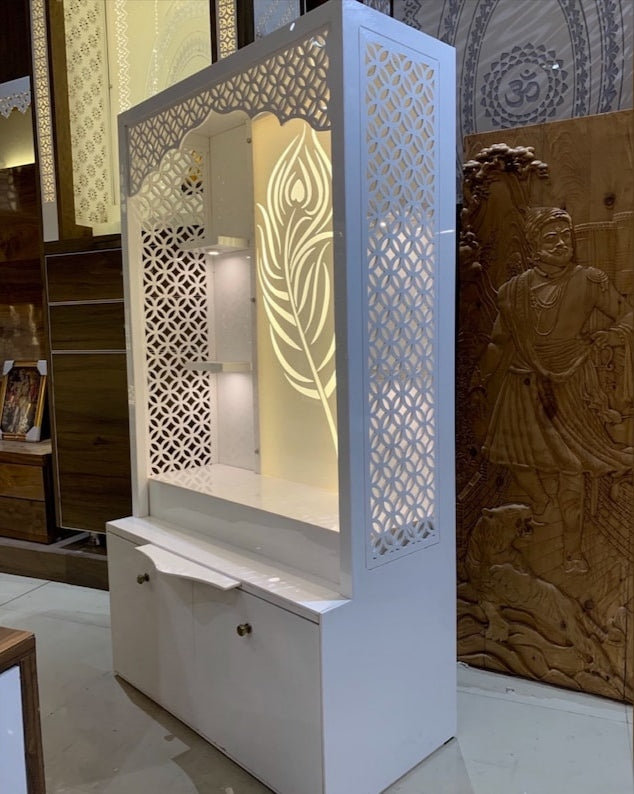A contemporary pooja mandir with a sleek white finish, floral lattice cutouts, and spacious storage for religious essentials.