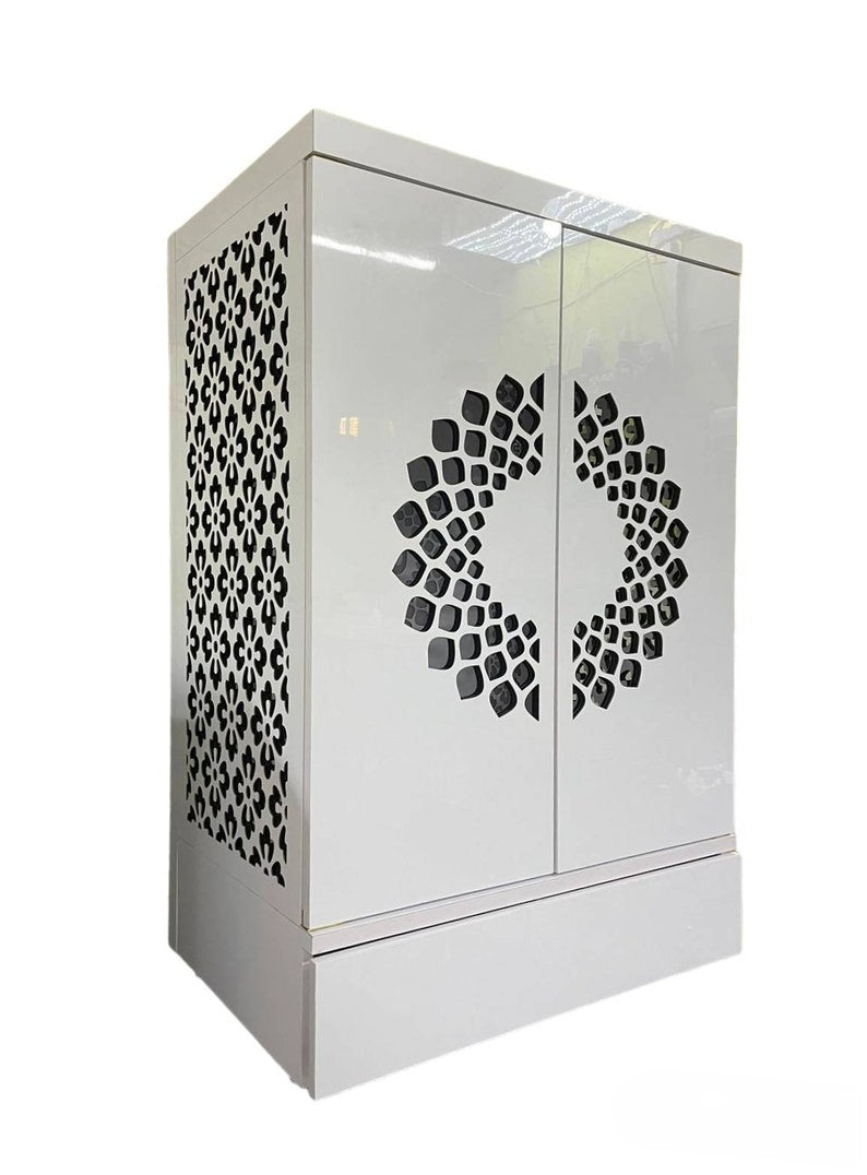A luxurious prayer cabinet with a white high-gloss finish, sophisticated geometric cutouts for ventilation, and an internal shelf for idols and offerings.