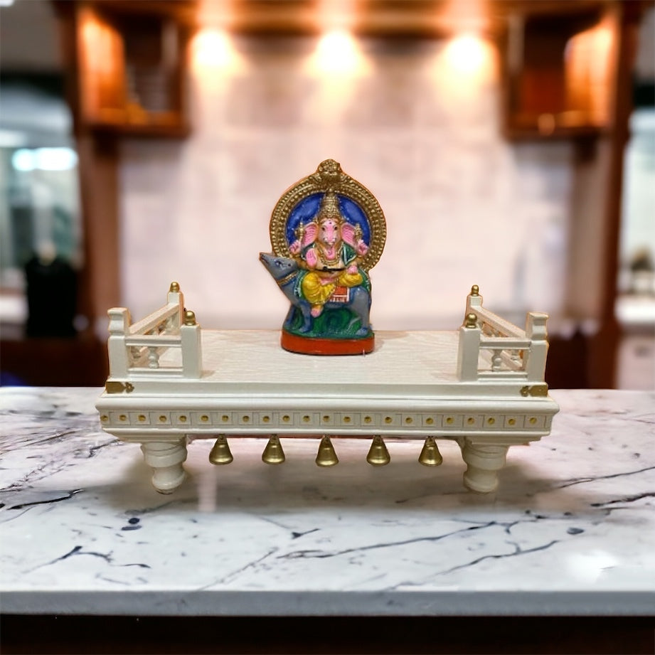 Handcrafted white wooden puja chowki with gold detailing, featuring intricate carvings and sturdy legs – a perfect addition to any home mandir or altar.