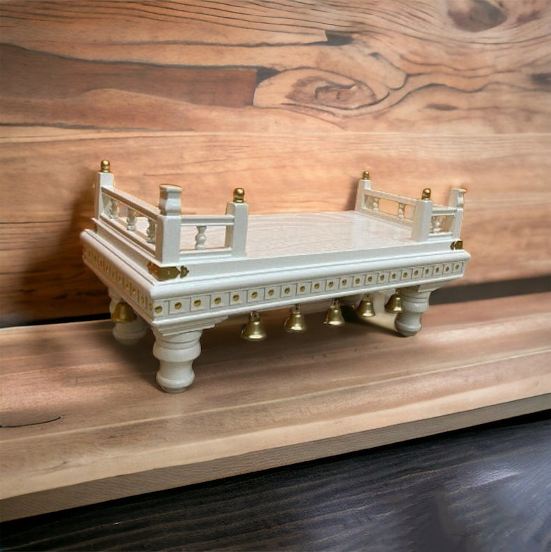 Beautifully designed white wooden puja chowki with gold embellishments, perfect for home temples, pooja rooms, and spiritual rituals.