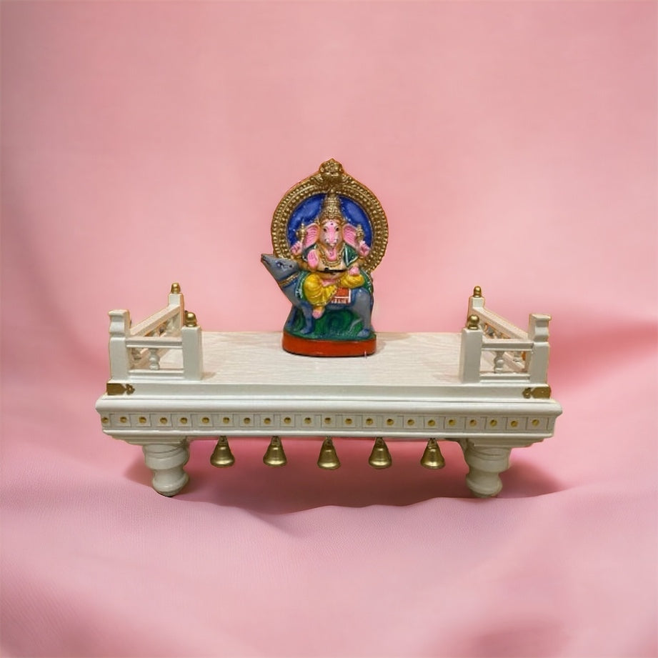 Traditional Indian puja chowki with an elegant white and gold finish, ornate railings, and decorative bells – ideal for religious ceremonies and offerings.