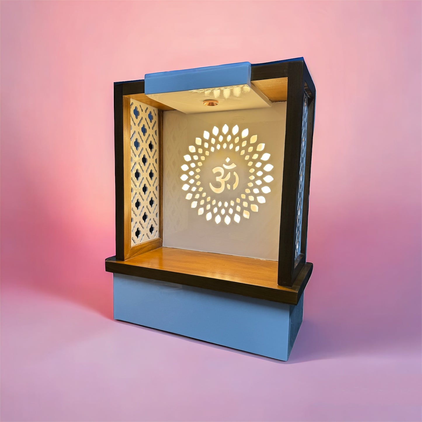 Intricately crafted wooden temple unit with elegant side jali work and illuminated Om back panel, ideal for compact worship spaces.