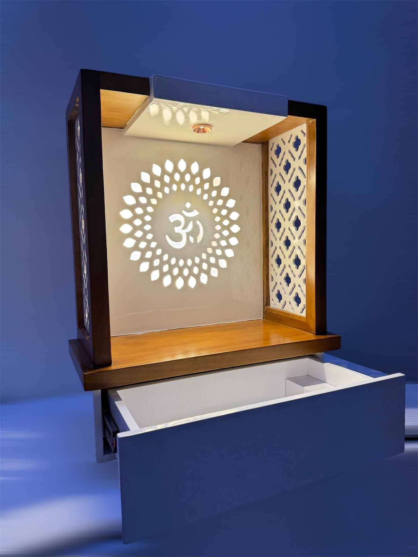 Space-saving wooden pooja unit featuring decorative side grills, pull-out drawer, and radiant backlit Om symbol to enhance your home’s spiritual aura.