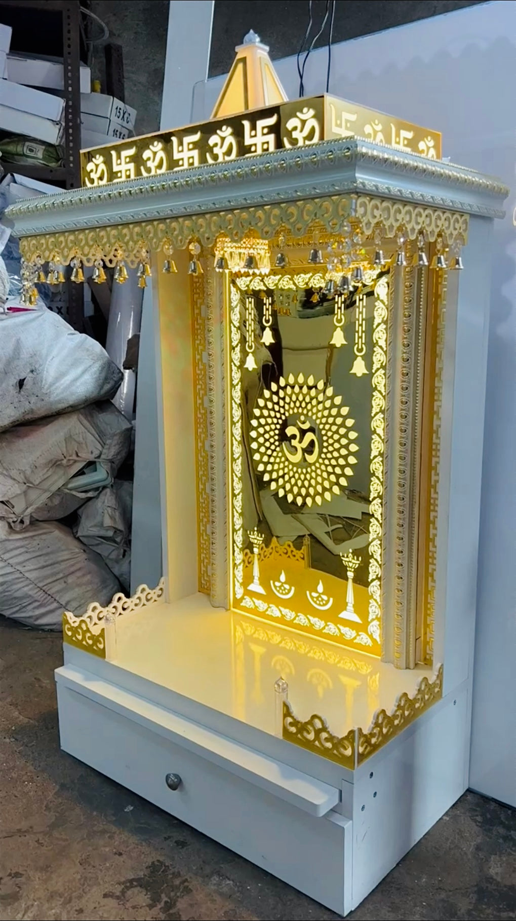 Luxury white and gold wooden Pooja Mandir with LED backlit Om design and brass bells