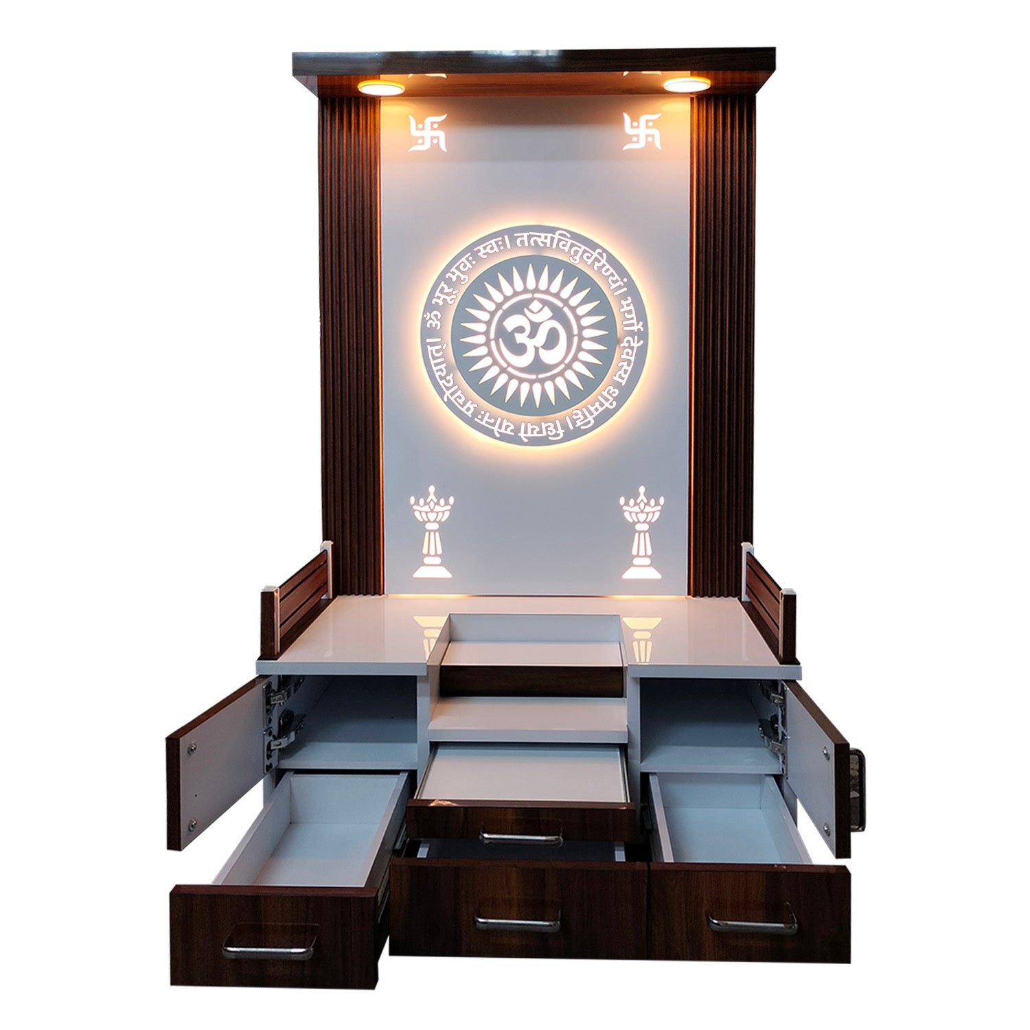 Modern wooden pooja mandir with OM backlit design, open drawers for storage, and swastik symbols on top