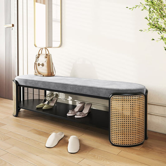 Modern entryway shoe bench with soft gray cushion and rattan side panels, featuring under-bench shoe storage shelf.