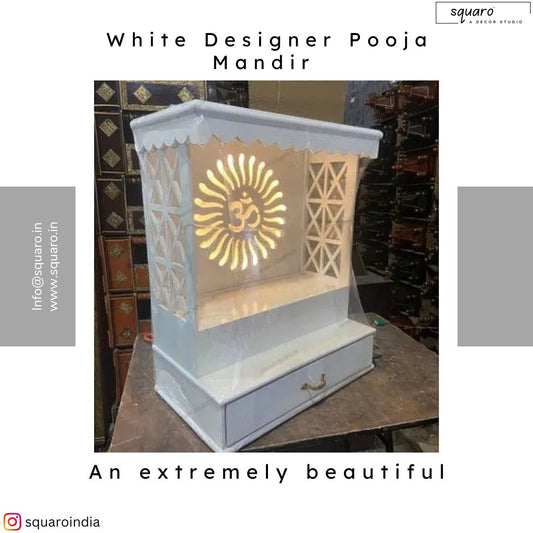 A beautifully crafted white wooden pooja mandir with intricate latticework and a glowing Om symbol, perfect for home temples and spiritual spaces.
