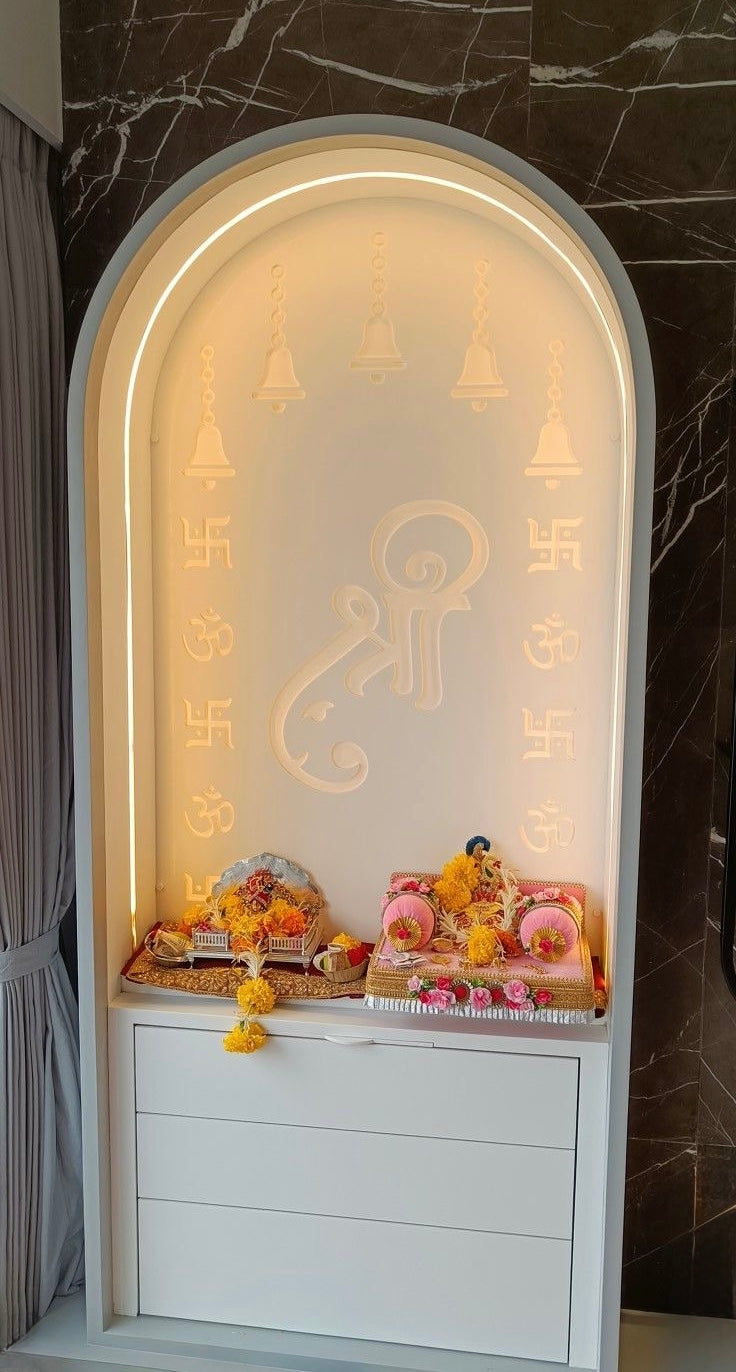 Contemporary Corian pooja mandir with laser-cut Shree, Om, and Swastik symbols, soft LED lighting, and a minimalist aesthetic ideal for apartments.