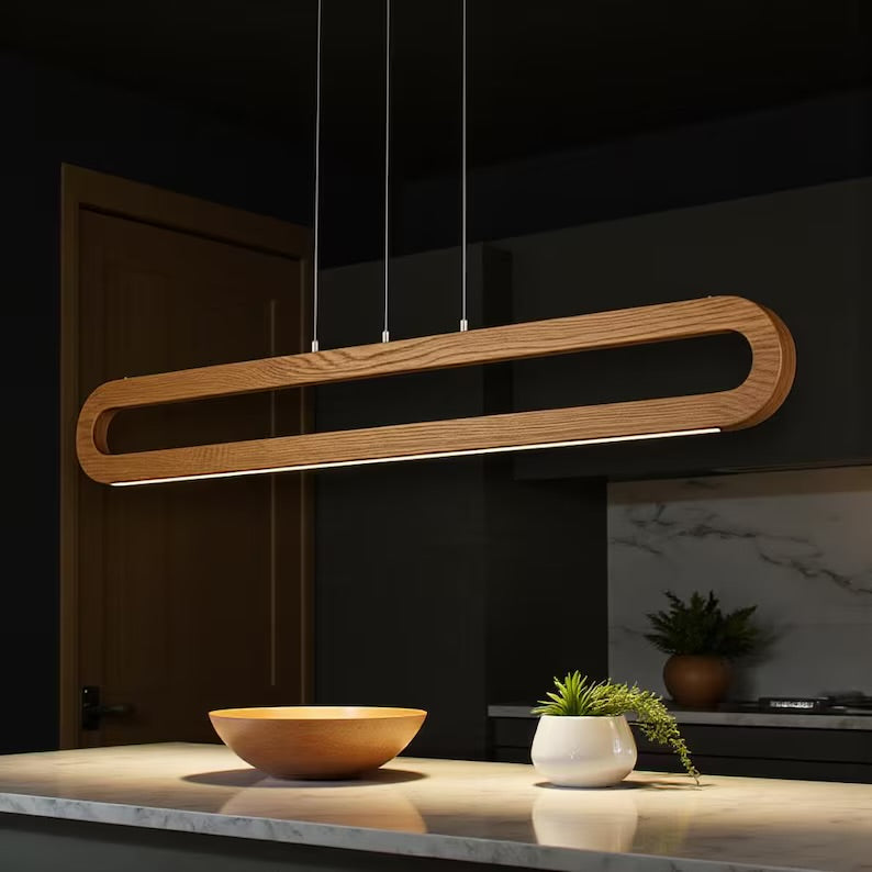 Modern wooden LED pendant light hanging above kitchen island
