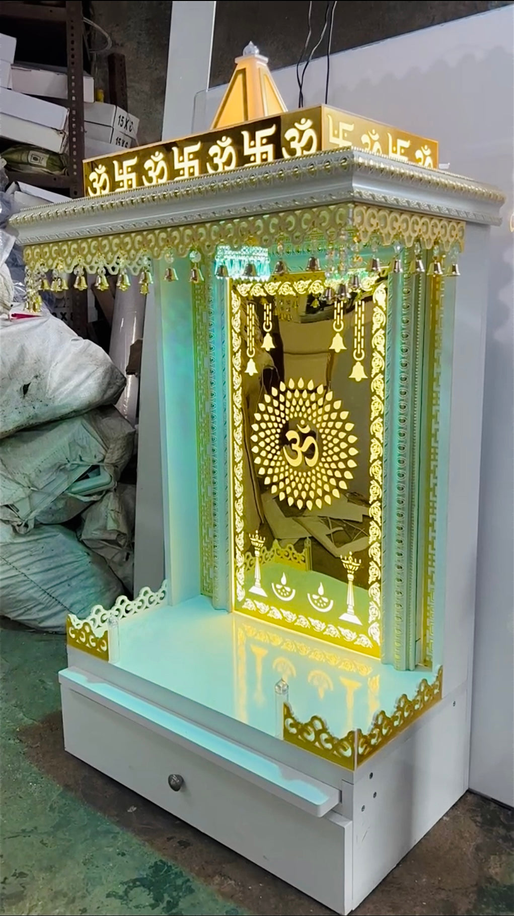 Designer wooden Pooja Mandir with drawer and LED lighting in gold finish