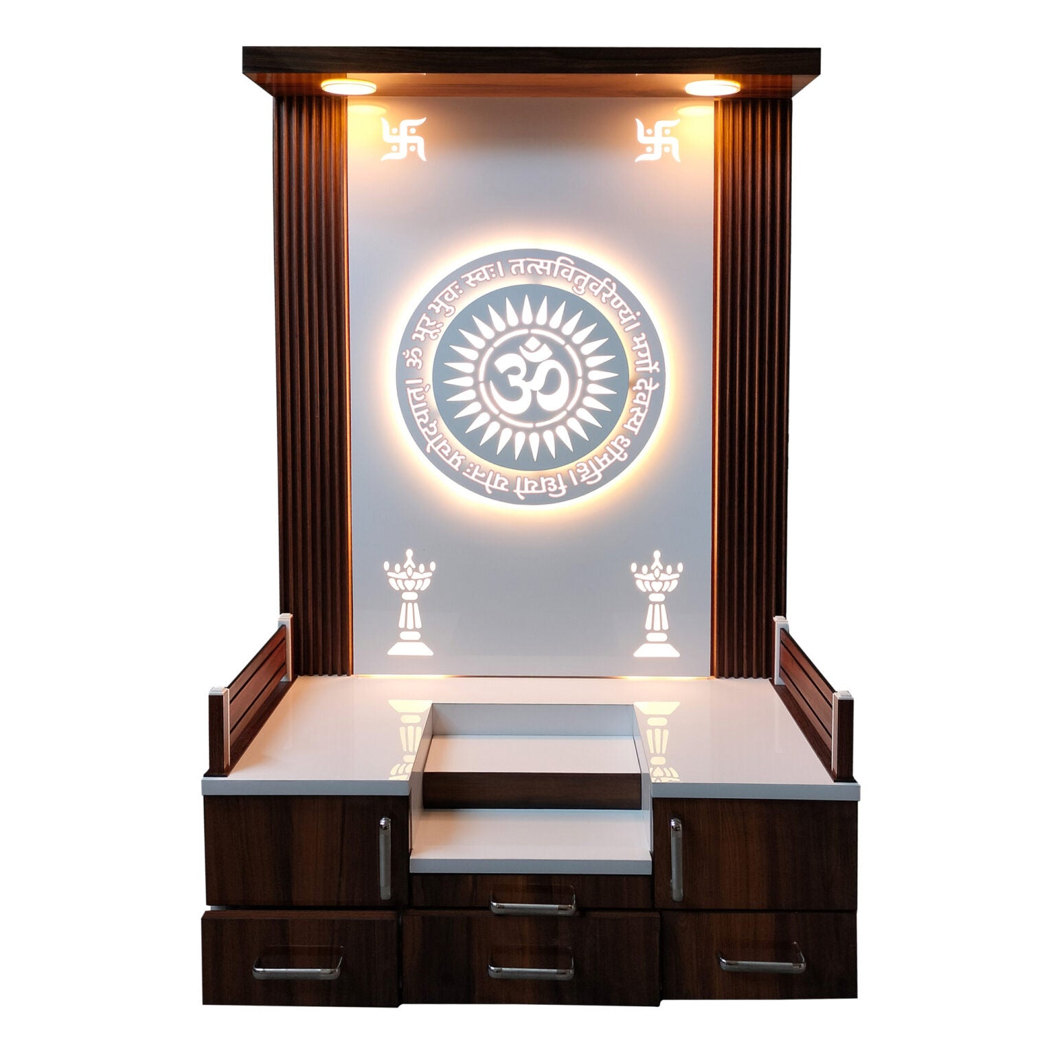 Modern wooden pooja mandir with OM backlit design, open drawers for storage, and swastik symbols on top