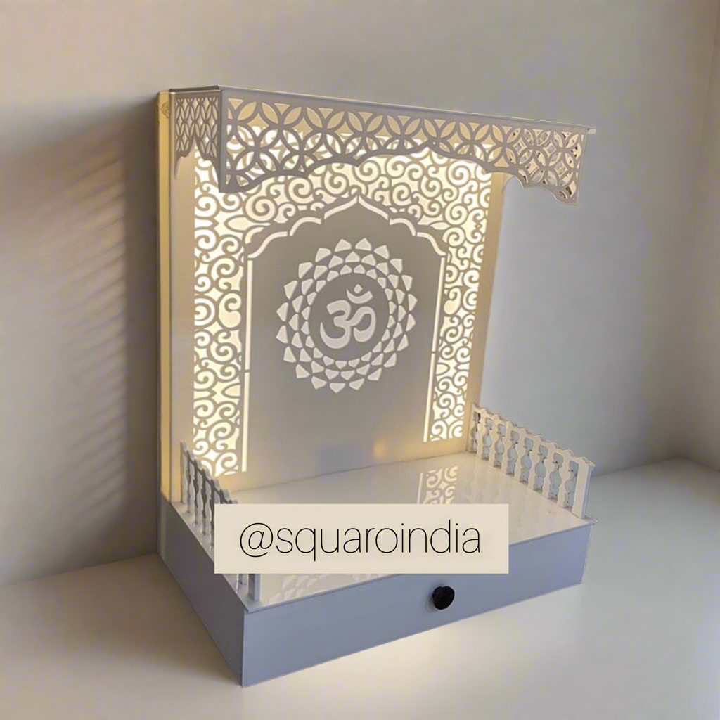 Stunning white pooja temple with a carved floral pattern, detailed lattice borders, and a built-in drawer for functional and aesthetic appeal.
