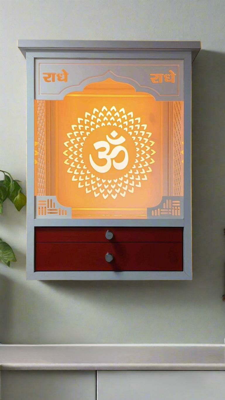 A modern devotional shrine featuring a glowing sacred Om symbol and elegant storage. Designed for urban homes with limited space.