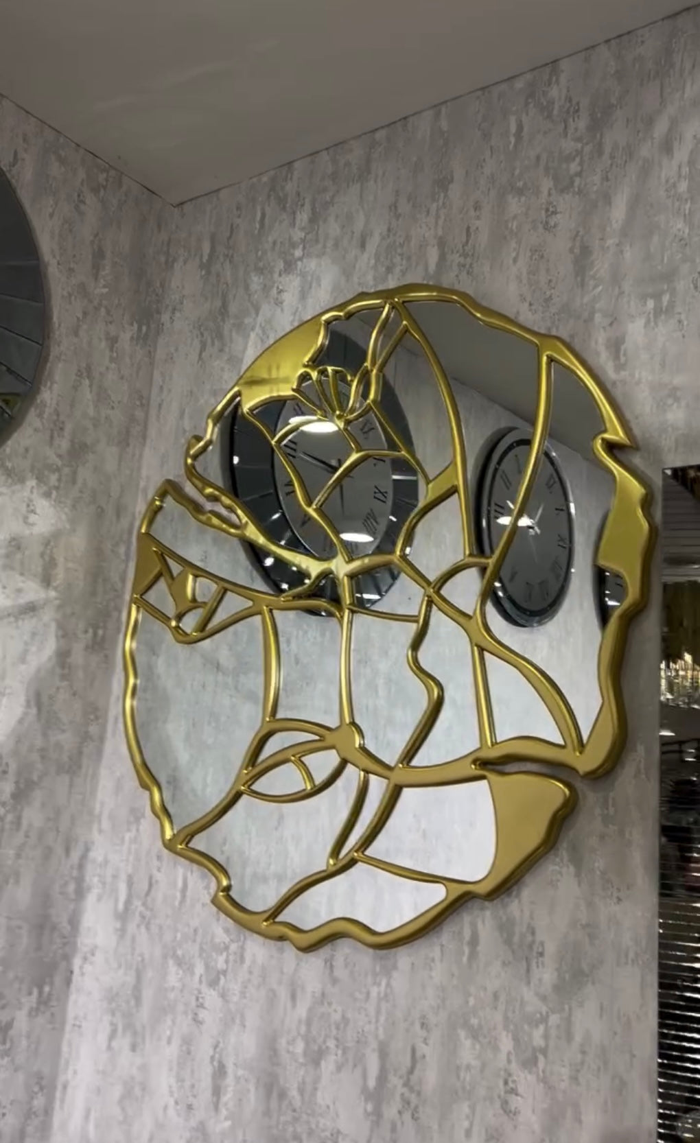 Elegant decorative round mirror with gold abstract female face design, ideal for modern interiors