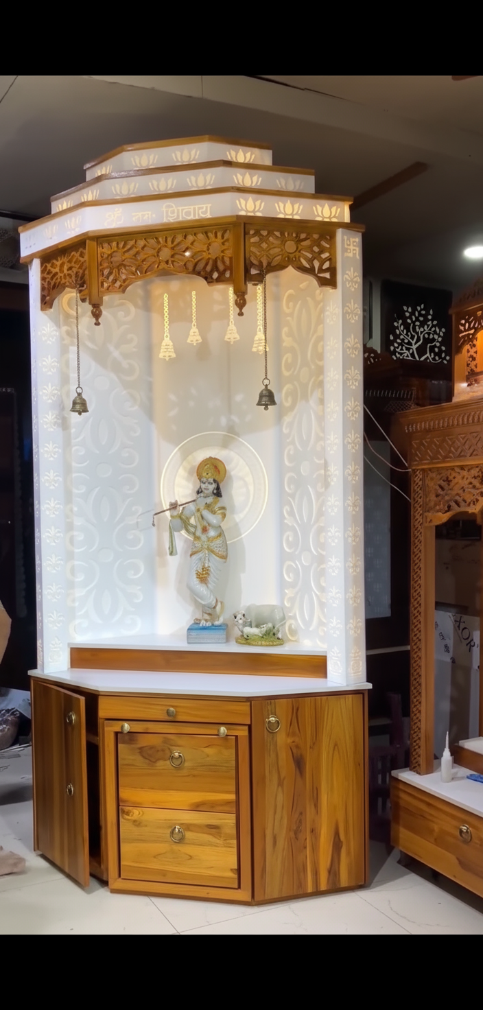 Premium teak wood pooja mandir with Corian backlit wall, LED illumination, and storage drawers for an elegant temple look.