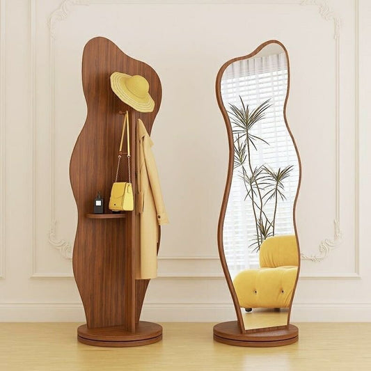Modern wavy full-length standing mirror with coat rack in matte black finish, featuring hat and bag hooks, ideal for entryways or bedrooms.