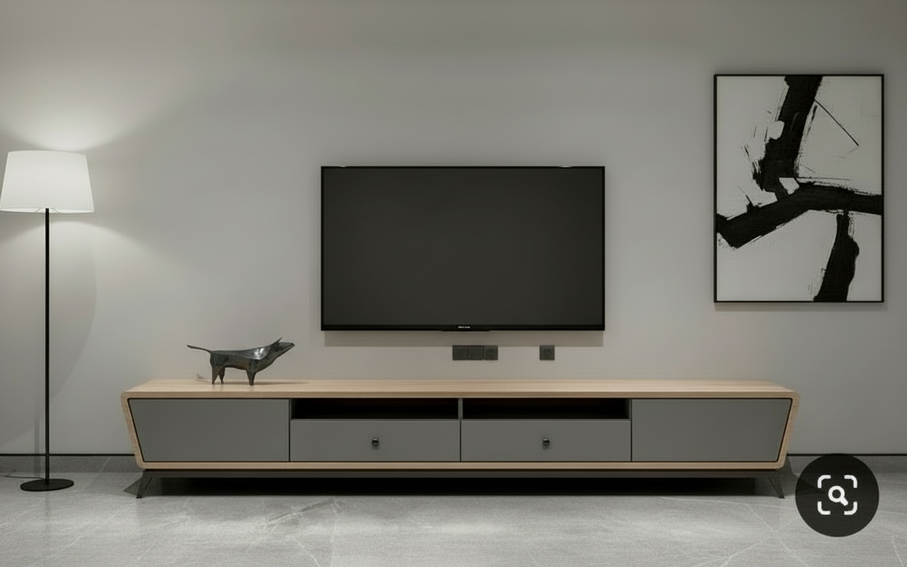 Modern wooden media console with grey drawers and decorative sculpture on top.