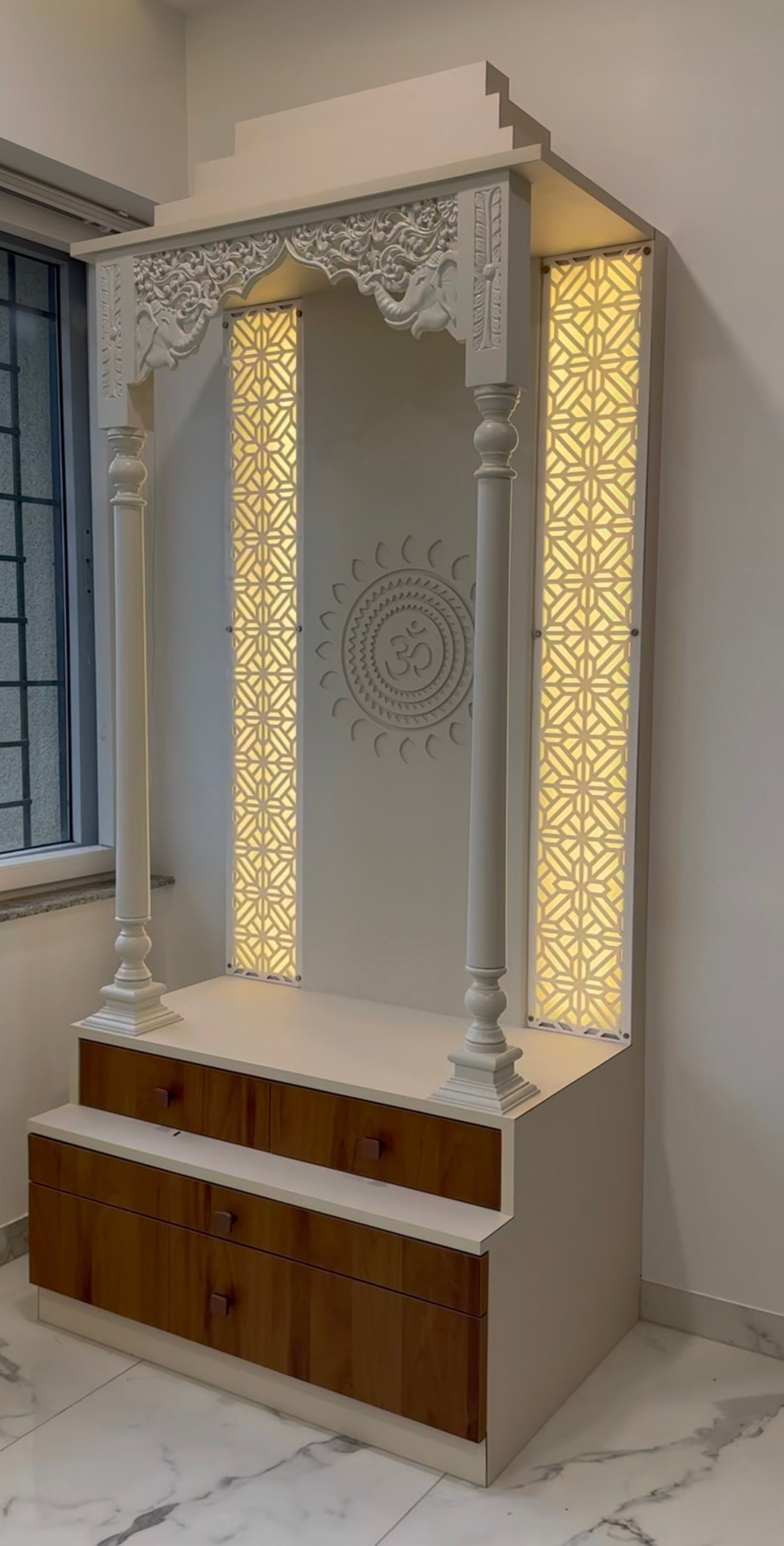 Modern white and walnut wooden temple with storage drawers and LED backlit side panels