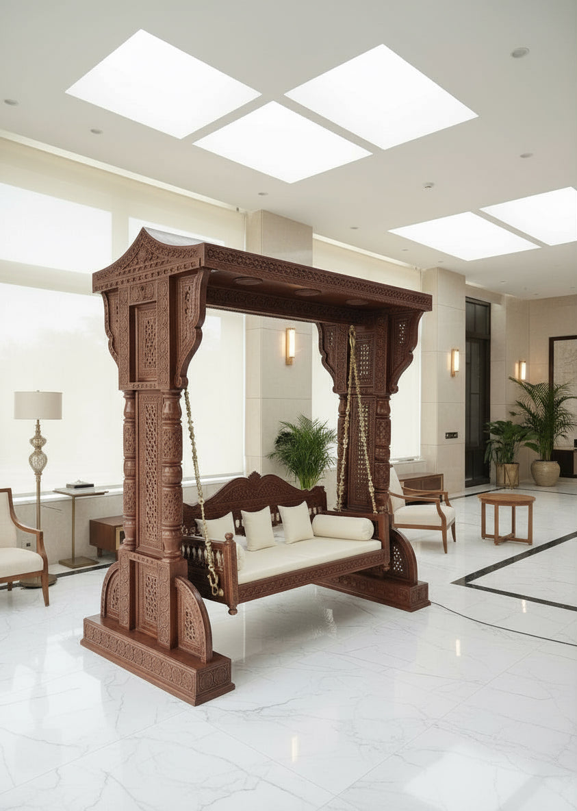 Handcrafted teak wood swing jhula with carved pillars and brass chains in living room