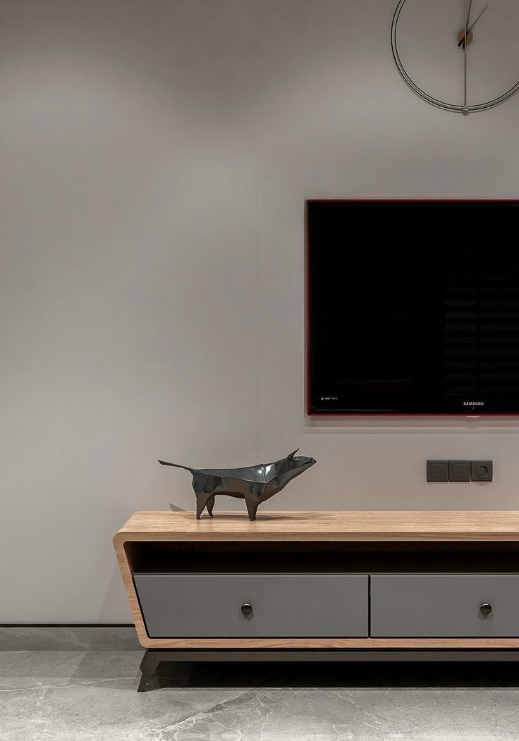 Contemporary TV stand placed under wall-mounted television.