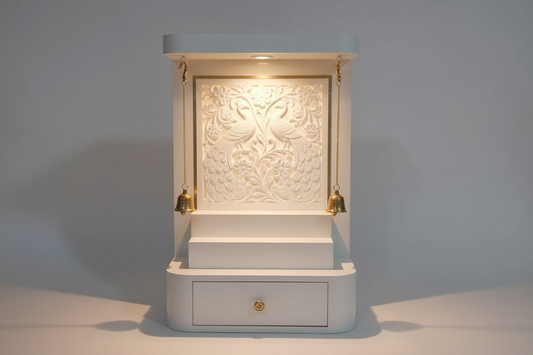 Modern wooden pooja mandir with LED backlit carved panel, brass bells, and storage drawer for home