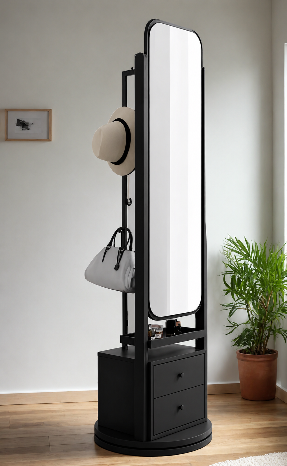 Black freestanding mirror with storage drawers in a room setting with a plant and framed picture.